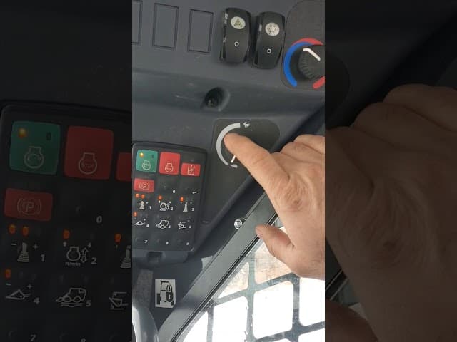 How to operate a John Deere 325G loader